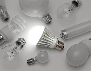 Lit up LED light among group of light bulbs